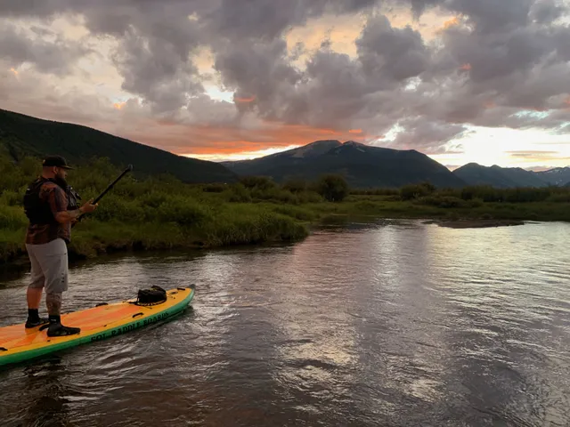 Paddleboarding the Slate River (wheelies and waves rental company)